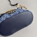 Replica Dior 30 Montaigne Mini Vanity Case against a floral backdrop