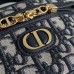 Replica Dior Caro Mini Vanity Case on a vanity table